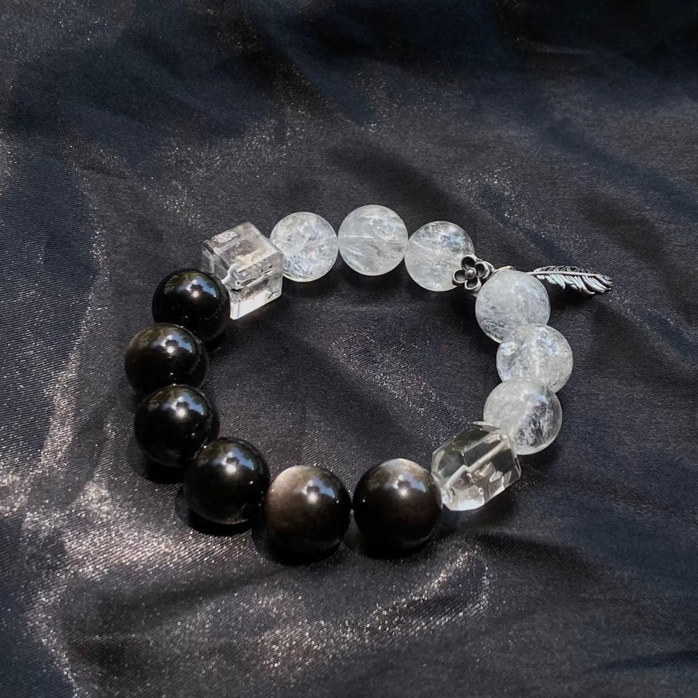 Black obsidian and clear quartz balance bracelet with silver-tone feather charm by LuckyWE product detail